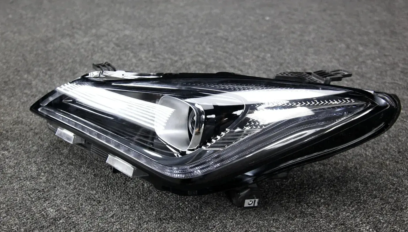 Headlamp part close-up showing lens and housing detail