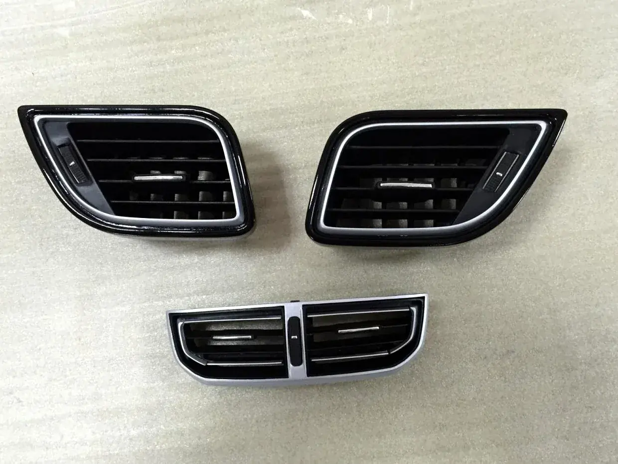 Fog lamp bezel and grille parts in black textured finish